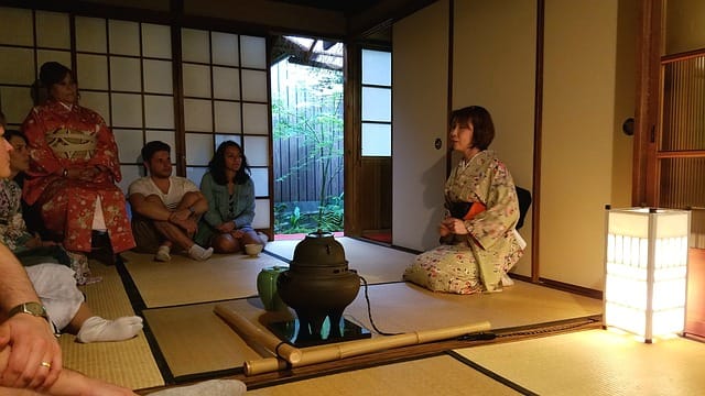 Tourists having a traditional Japanese tea ceremony in Kyoto