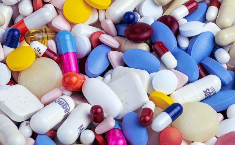 a collection of colourful tablets and pills