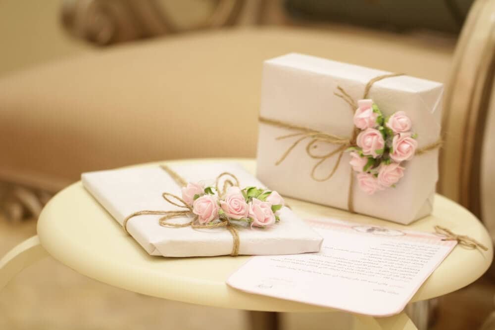 a pair of gift-wrapped presents for a wedding