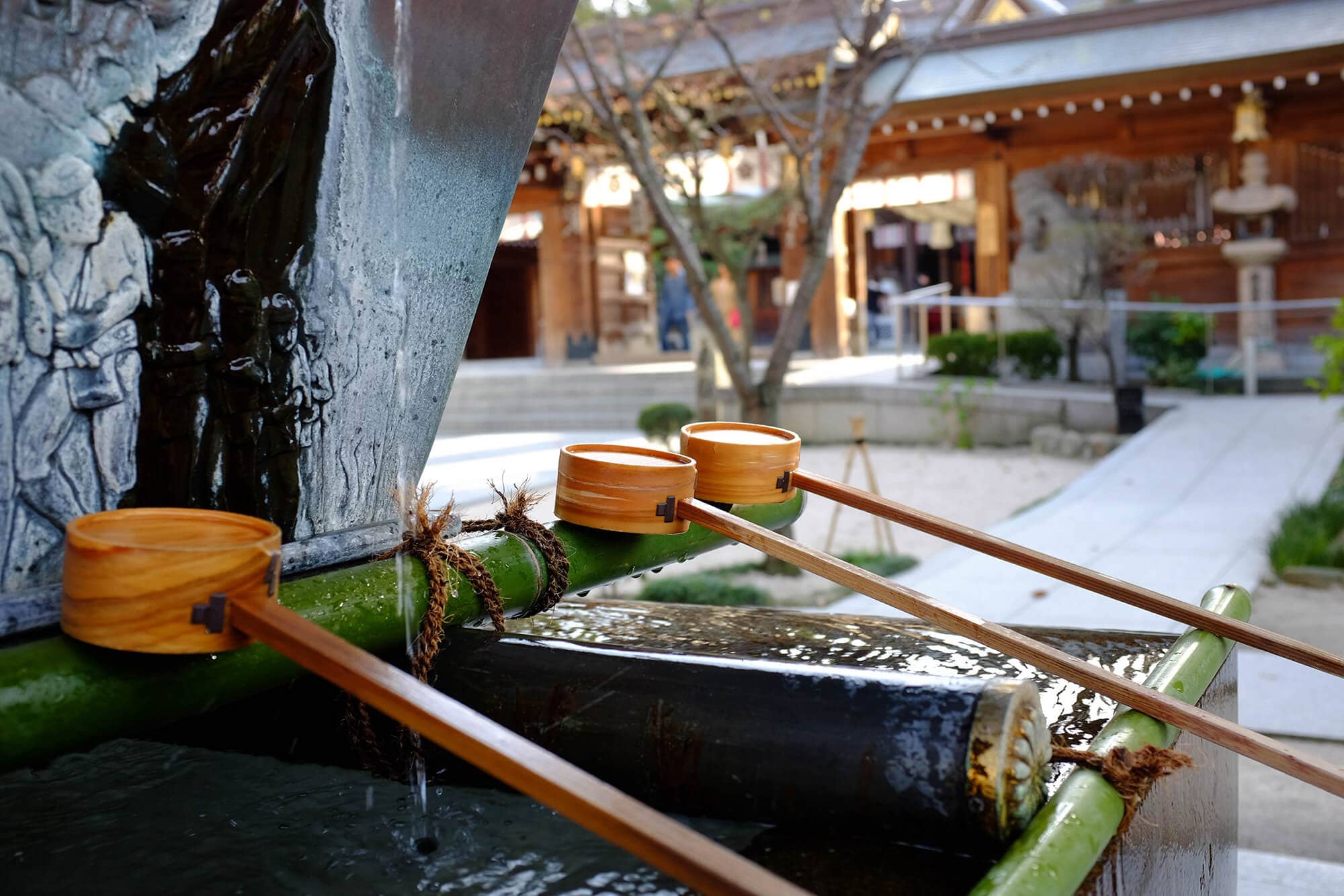 Wooden utensils at a fountain in a Japanese temple