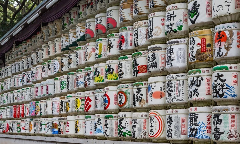 barrels of sake with colourful covers