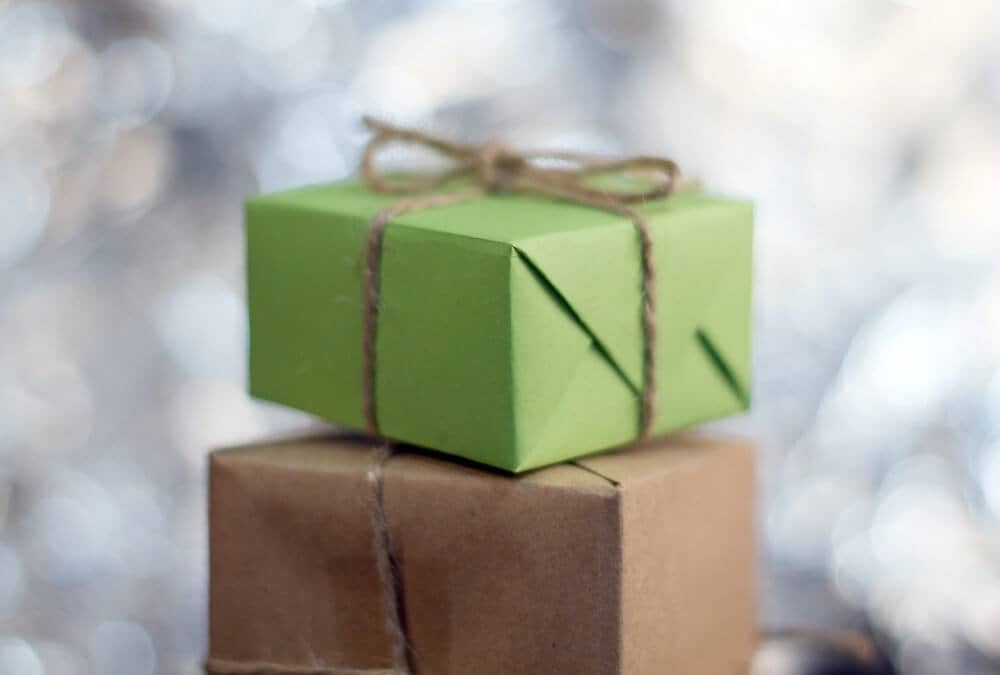 a pair of presents wrapped in brown and green paper