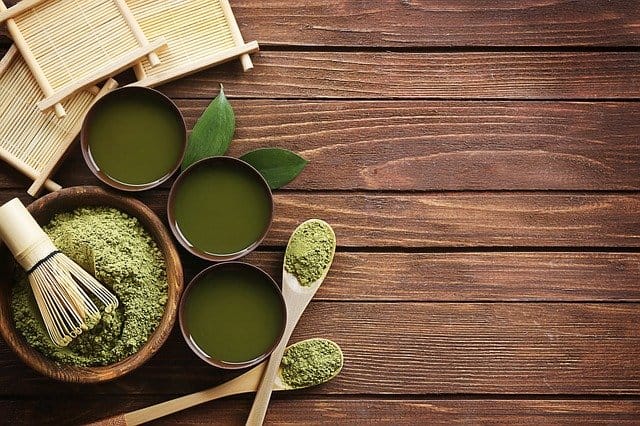 Matcha powder on a wooden table.
