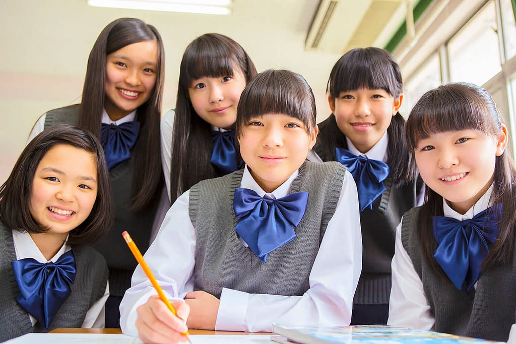 Japanese students in classroom posing for the camera