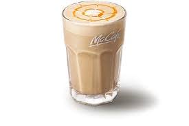 Orange latte with orange syrup on top
