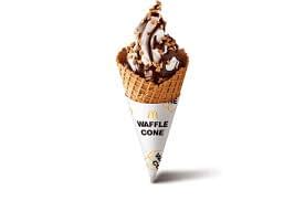 Waffle ice cream cone with icecream and chocolate sauce inside