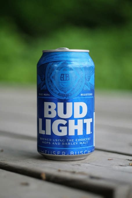 a can of bud light on a wooden table
