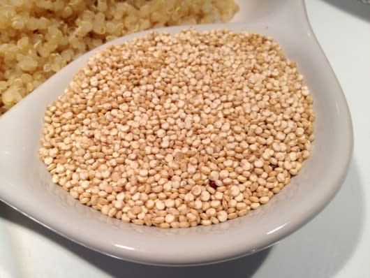 a bowl of quinoa on a white table