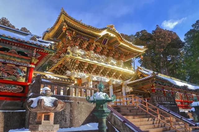 The Nikko Toshogu shrine, pictured against a clear blue sky.