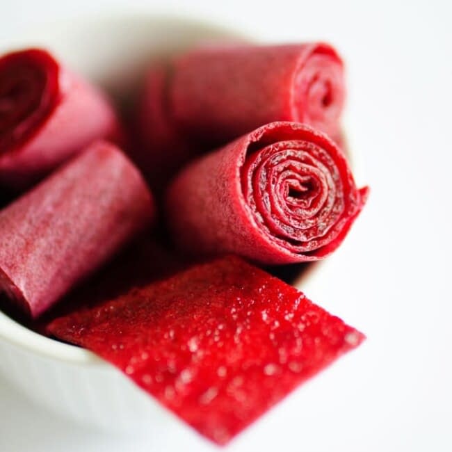 Red fruit roll ups in a bowl