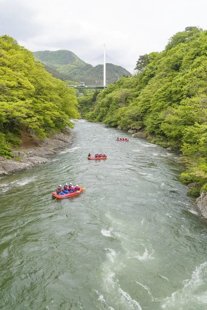 A river near Minakami Town, where a group of people are white water rafting