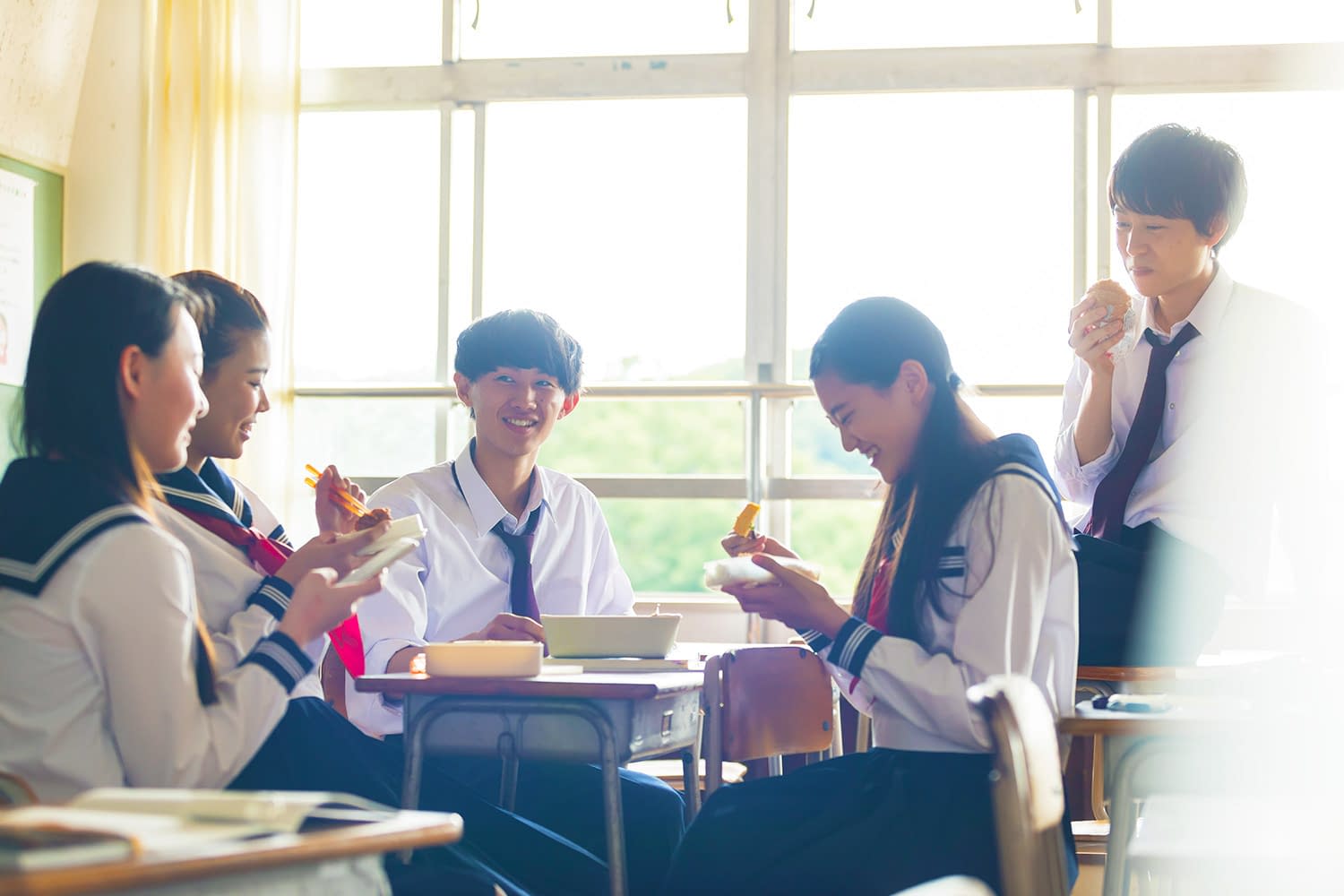 Japanese highschool students eating in classroom