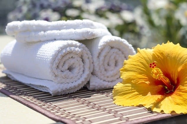 towels neatly folded on a mat