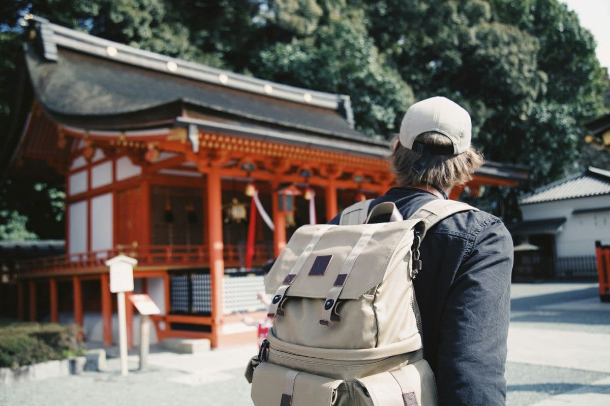 man with backpack exploring Japan