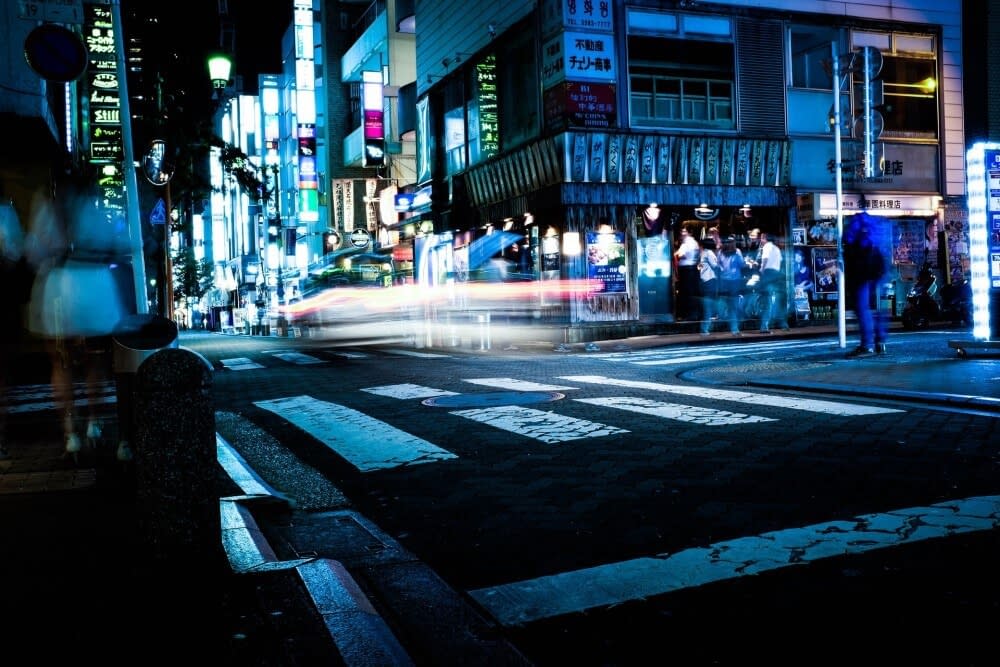 a zebra crossing in Tokyo at night
