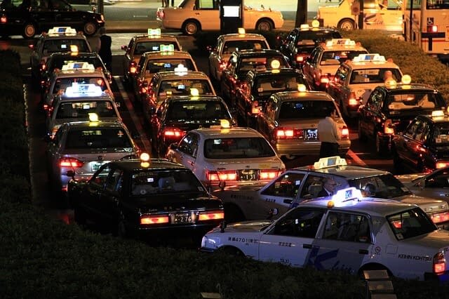 Japanese taxis waiting at a taxi rank for customers