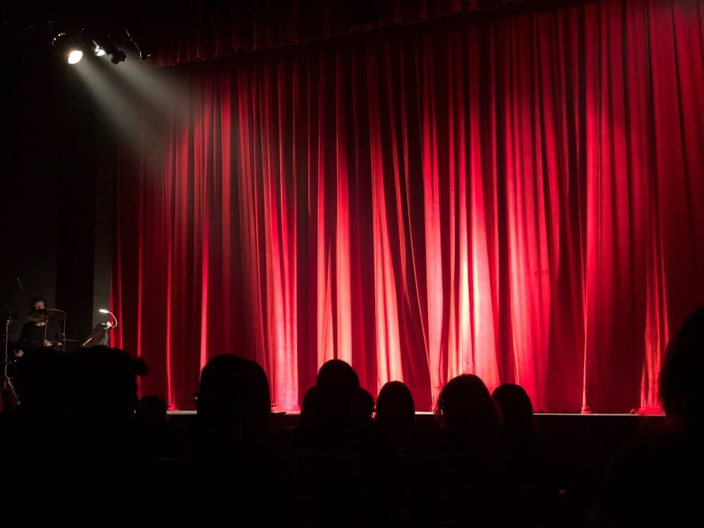 red-curtain-at-a-theater-performance