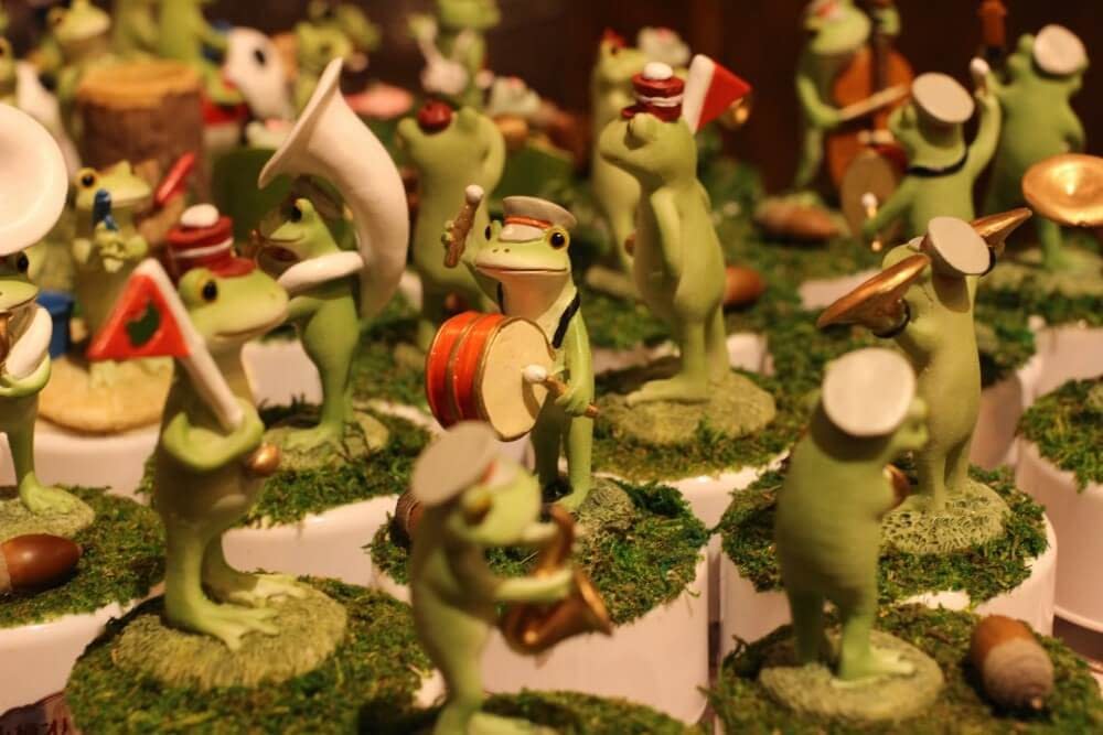 a collection of frog statues