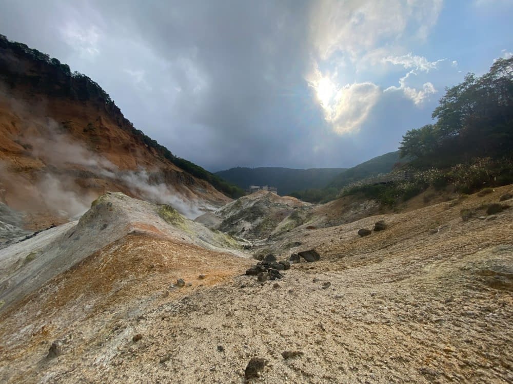 A breathtaking view of hot springs nestled in the mountains of Noboribetsu, Japan.